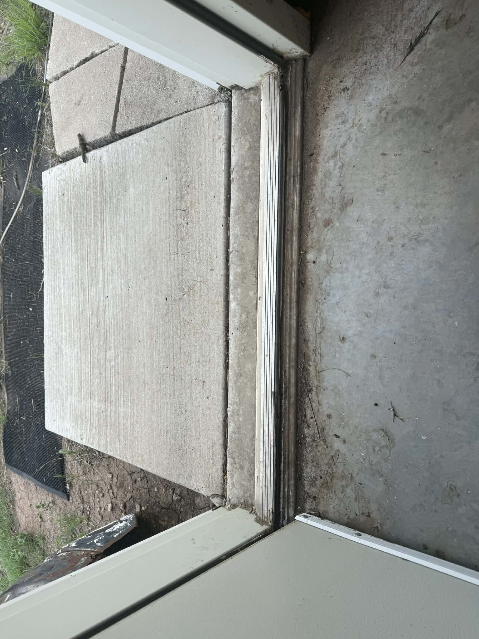 Replaced a worn door threshold to improve the seal, functionality, and appearance of the doorway. 