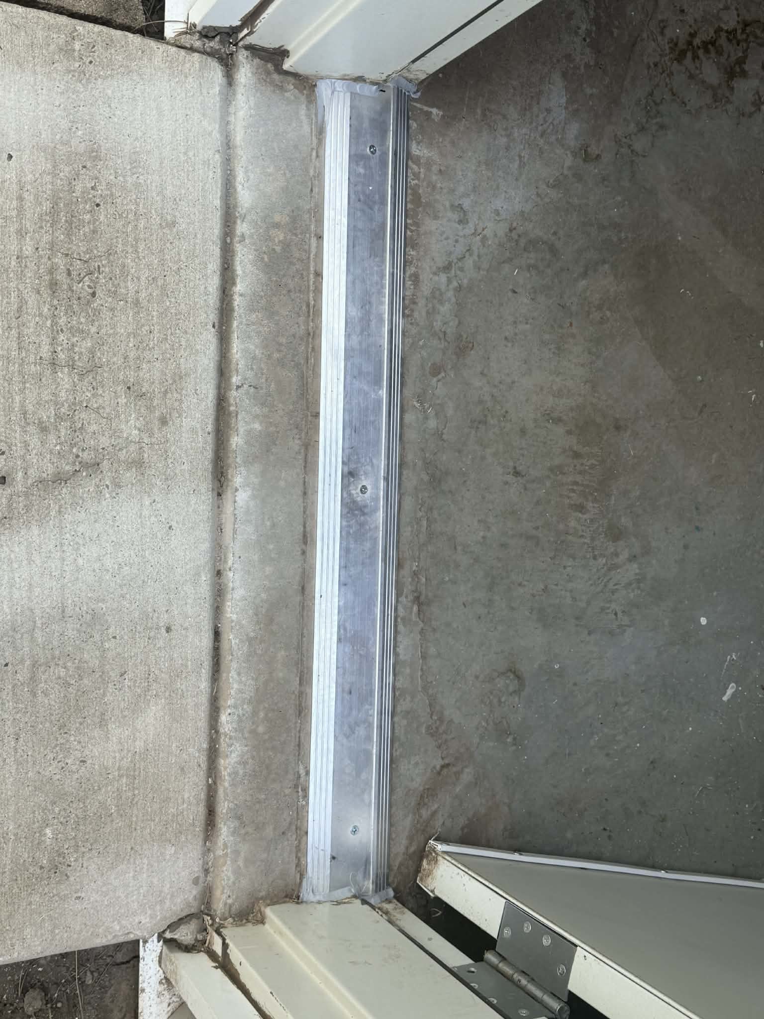 Replaced a worn door threshold to improve the seal, functionality, and appearance of the doorway. 