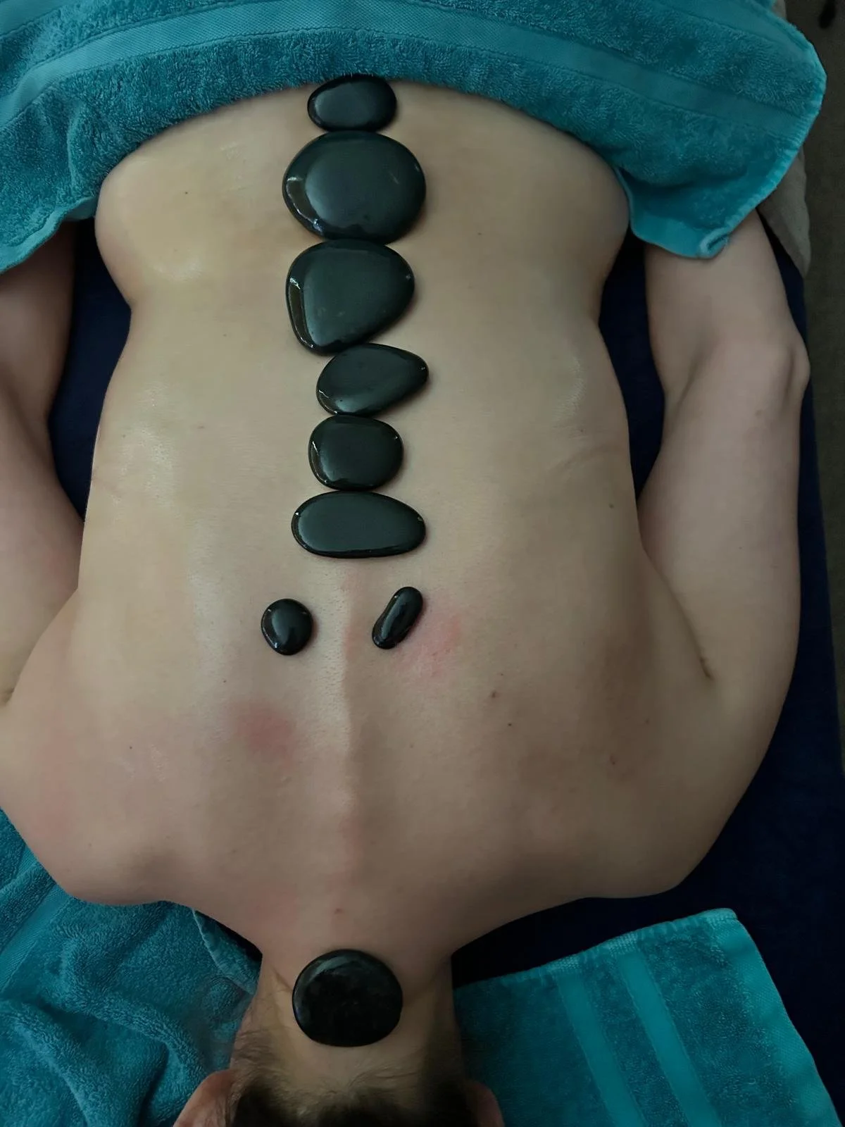 Hot stone massage therapy session - Warwickshire, Root & Rise