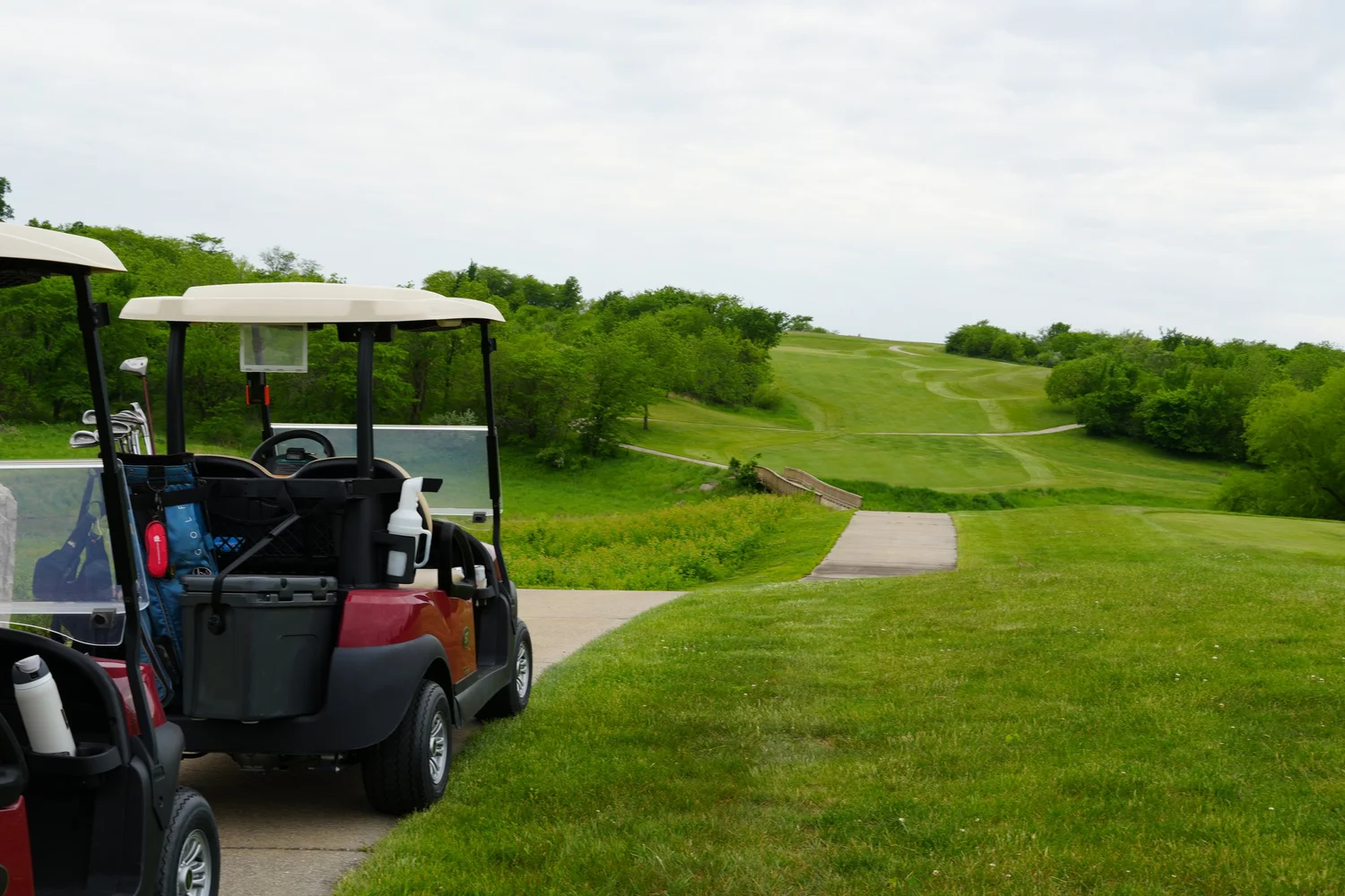 Golf cart and course at Honey Creek Resort