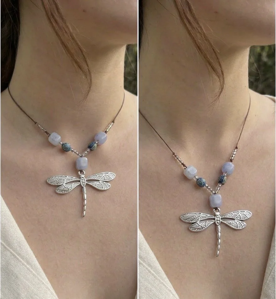 A woman wearing a silver dragonfly pendant necklace with blue and white beads on a brown cord.