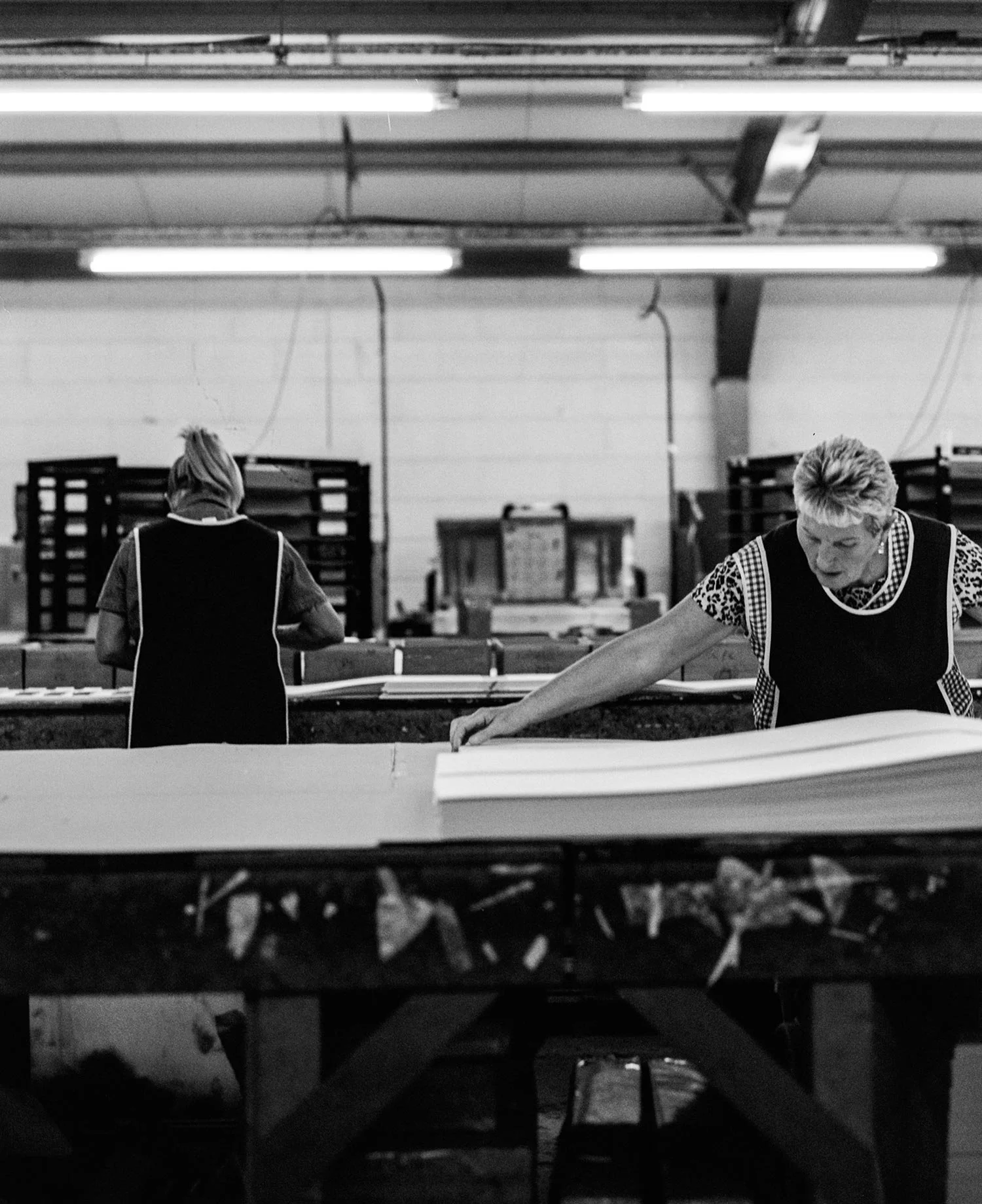 Team member laying out fabric