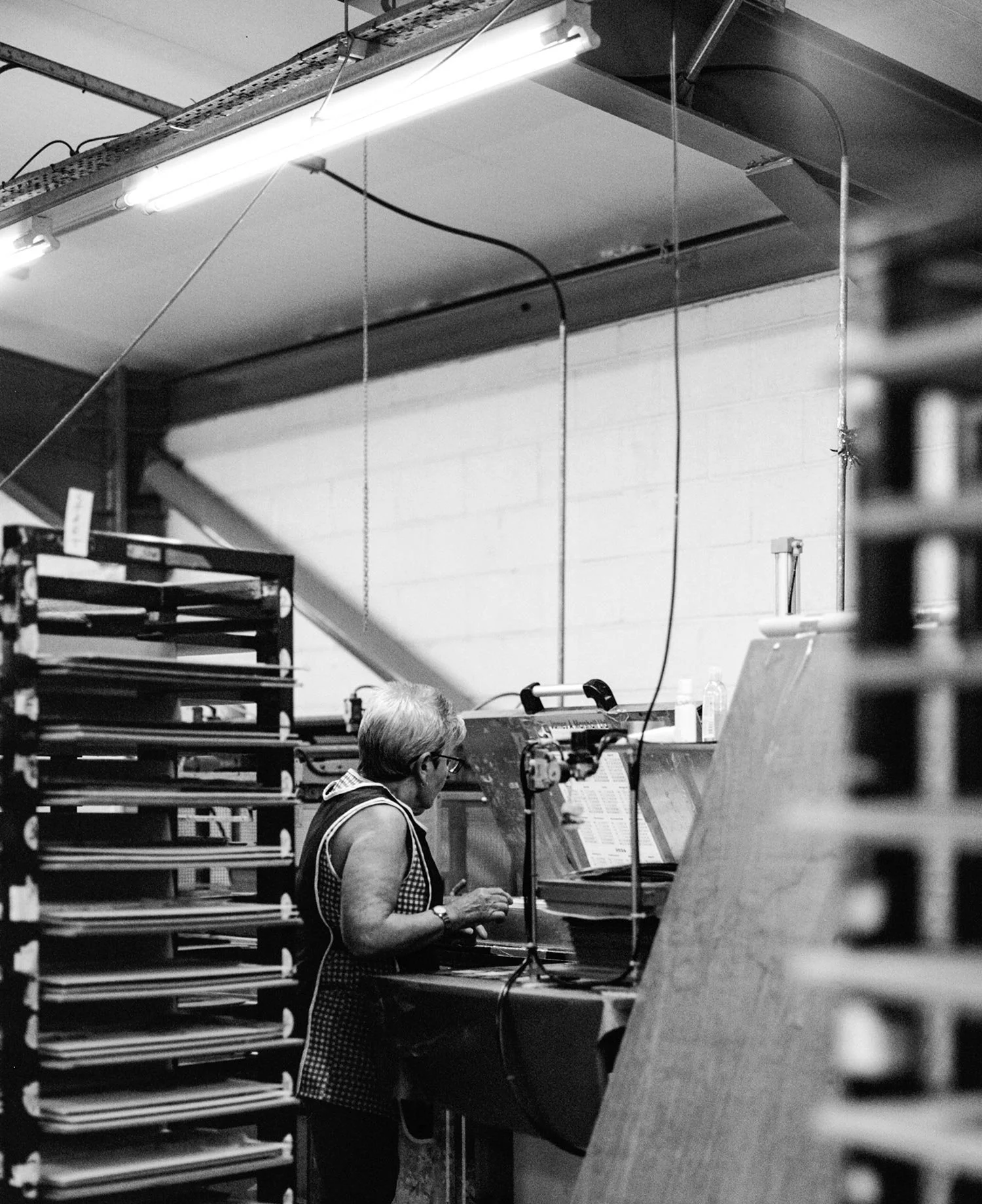 Team member working on press