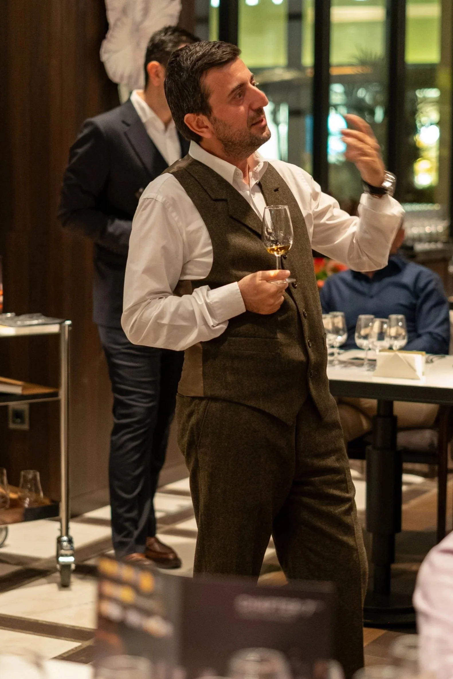 San Eylem Dogan performing a Scotch Whisky gourmet dinner pairing event for Chapter 7 Whisky.