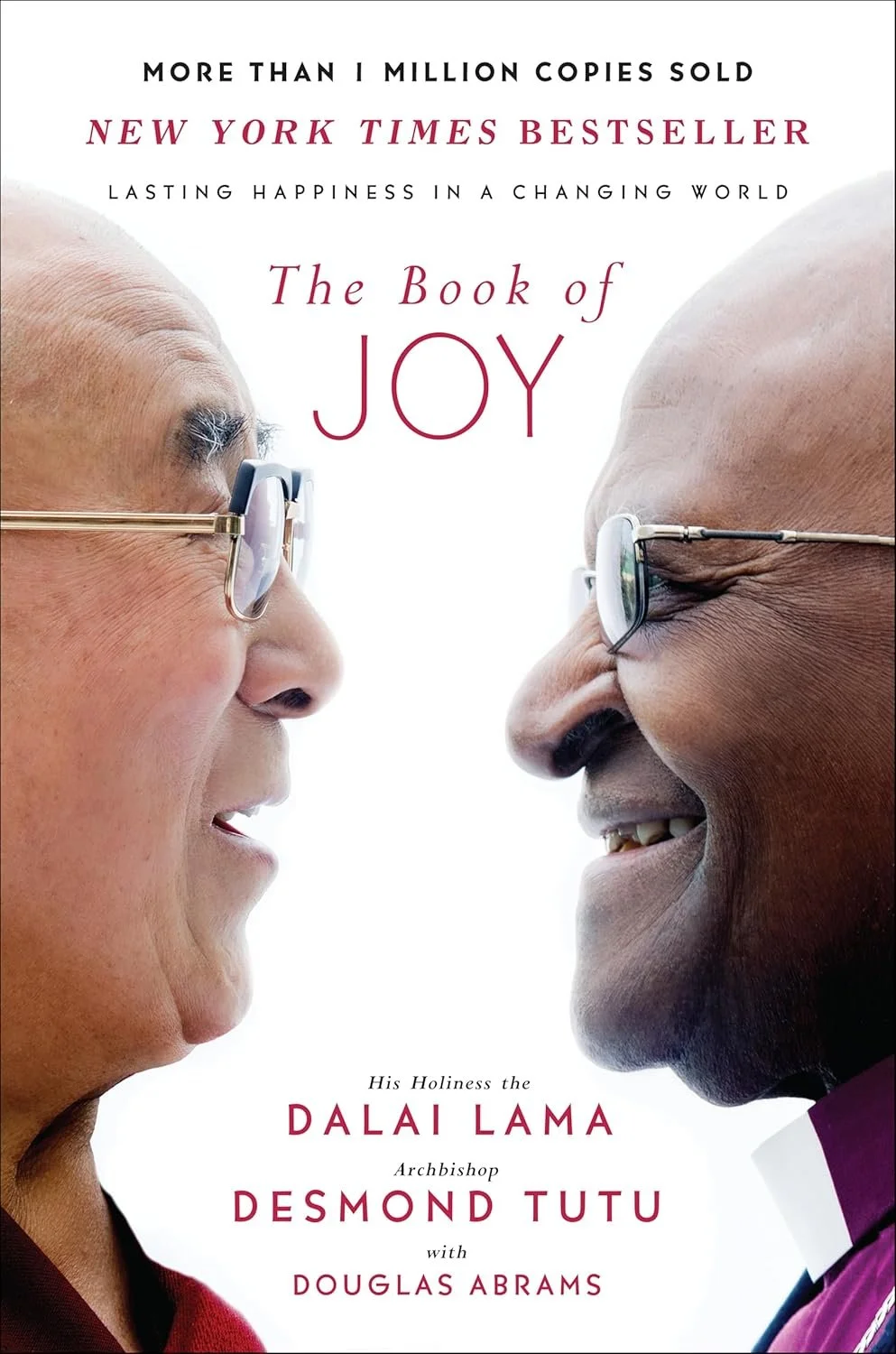 Book cover featuring a close-up face-to-face shot of the Dalai Lama and Archbishop Desmond Tutu, both wearing glasses, smiling at each other.