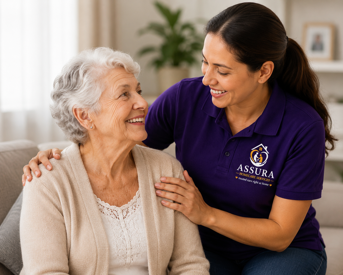 Compassionate Assura Home caregiver assisting an elderly client at home in a warm and comfortable living environment.”