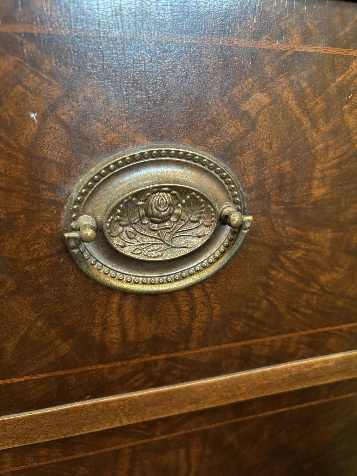 1950s Zenith radio phonograph console with burled wood and brass diamond-lattice grille, detail of metalwork handle, Evelyn's Emporium Saint Paul