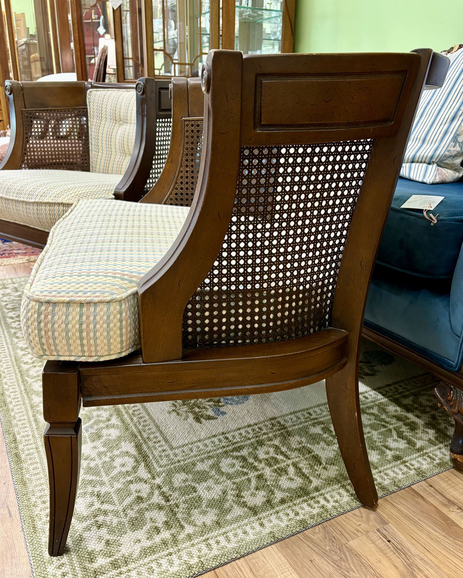 Pair of caned side chairs with tufted backs in pastel striped fabric and comfortable cushions, cane detail, Evelyn's Emporium Saint Paul