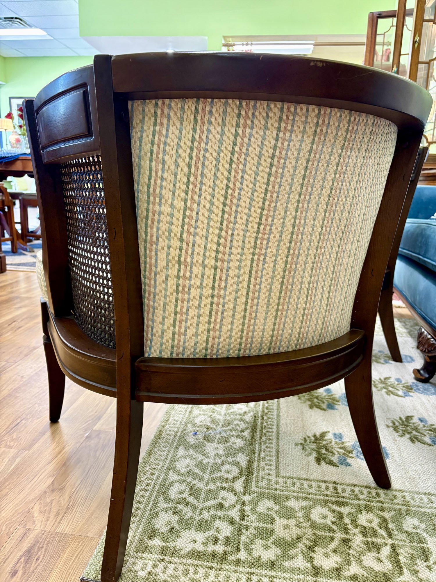 Pair of caned side chairs with tufted backs in pastel striped fabric and comfortable cushions, back view, Evelyn's Emporium Saint Paul