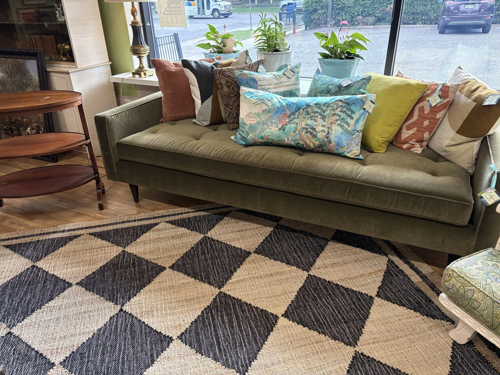 Hand-woven jute and wool checkered area rug with classic block print pattern, shown with a sofa, Evelyn's Emporium Saint Paul