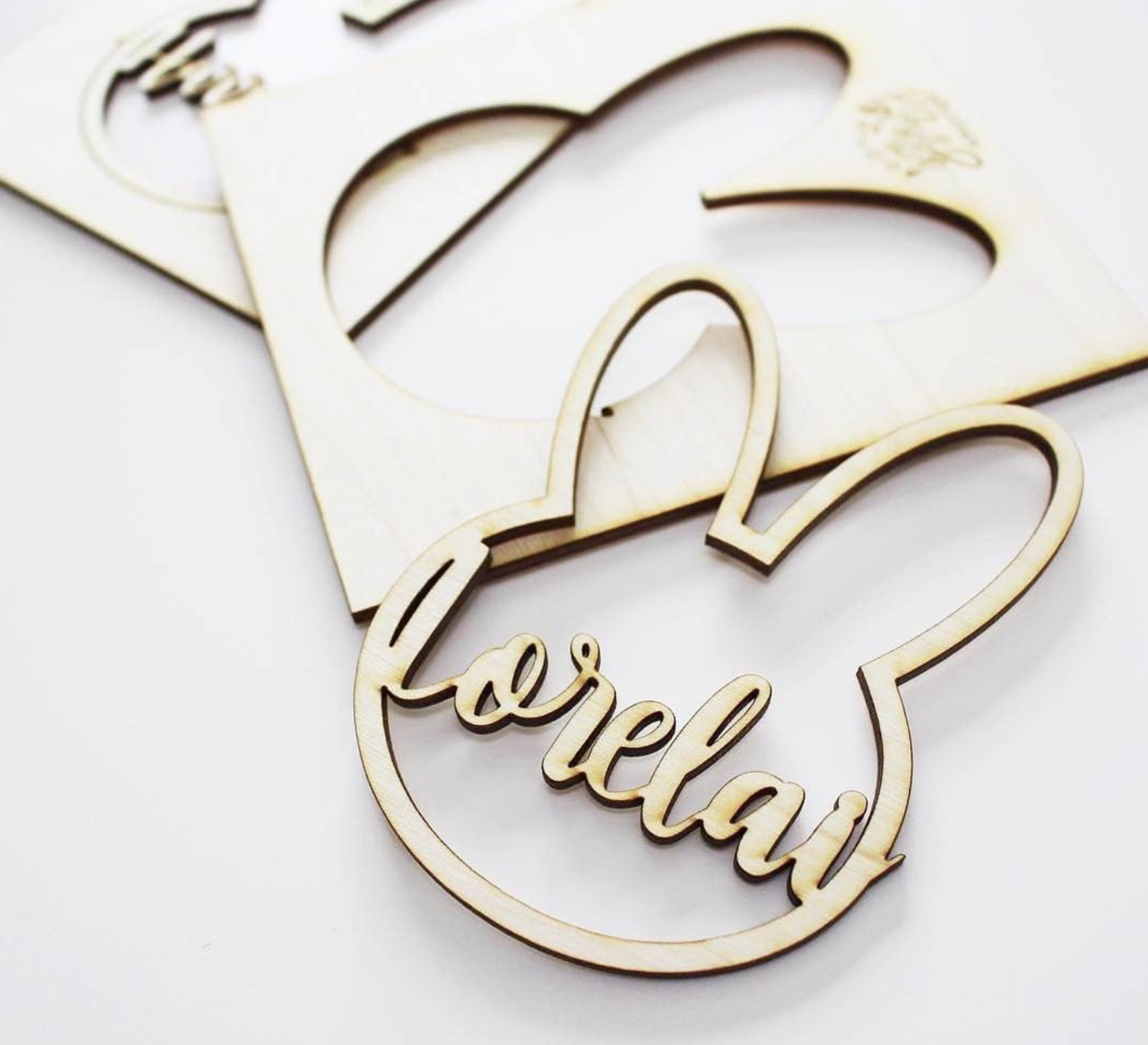 Wooden cutout with the phrase "Be Relax" in cursive font, with a heart shape around the words.