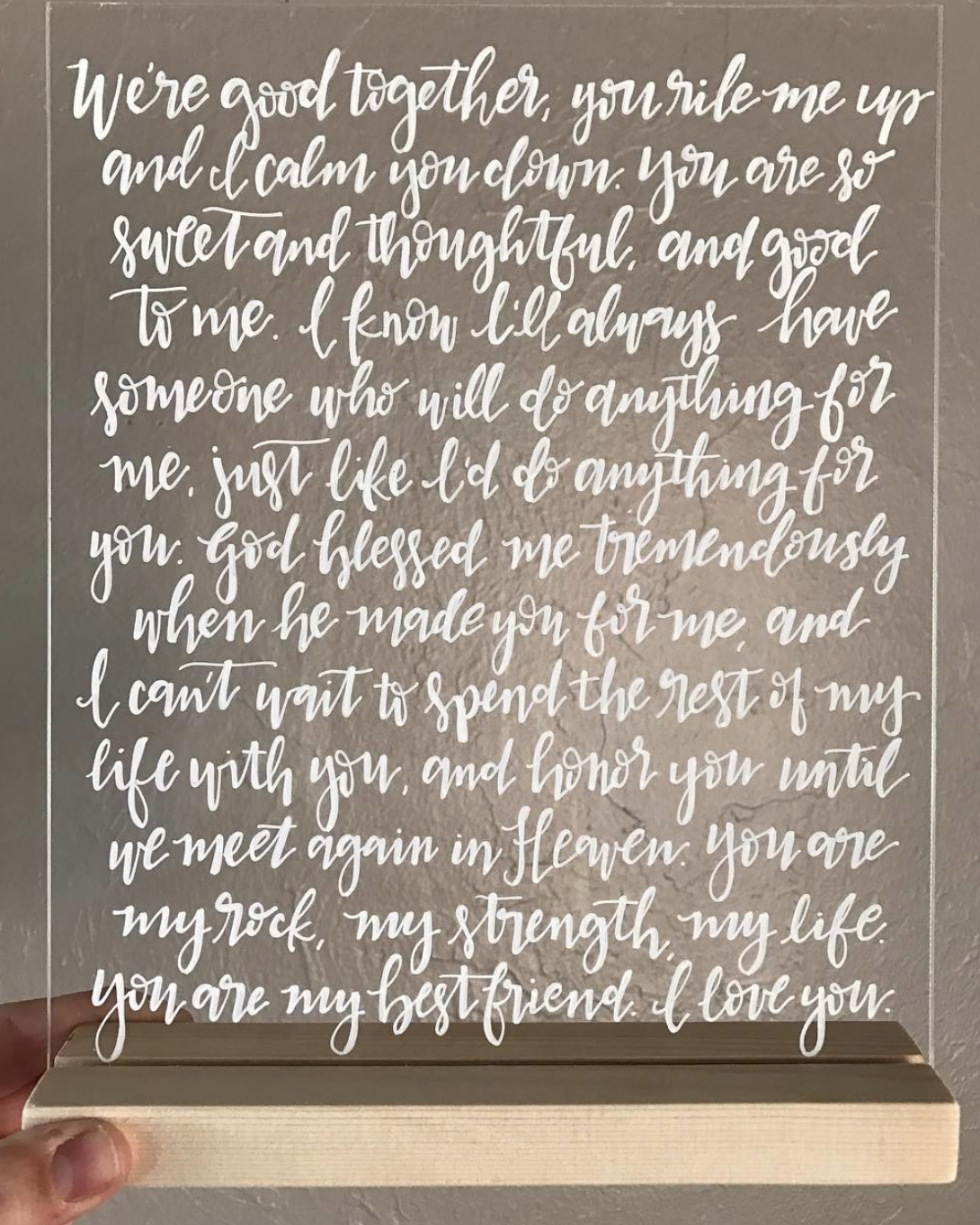 Decorative wooden sign with a heartfelt message written in white cursive letters, expressing love and appreciation for a partner.