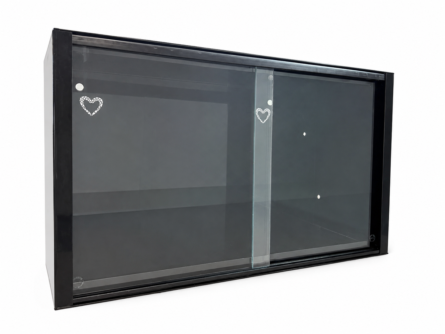 A black-framed glass cabinet with a sliding door, decorated with small heart designs on the glass.