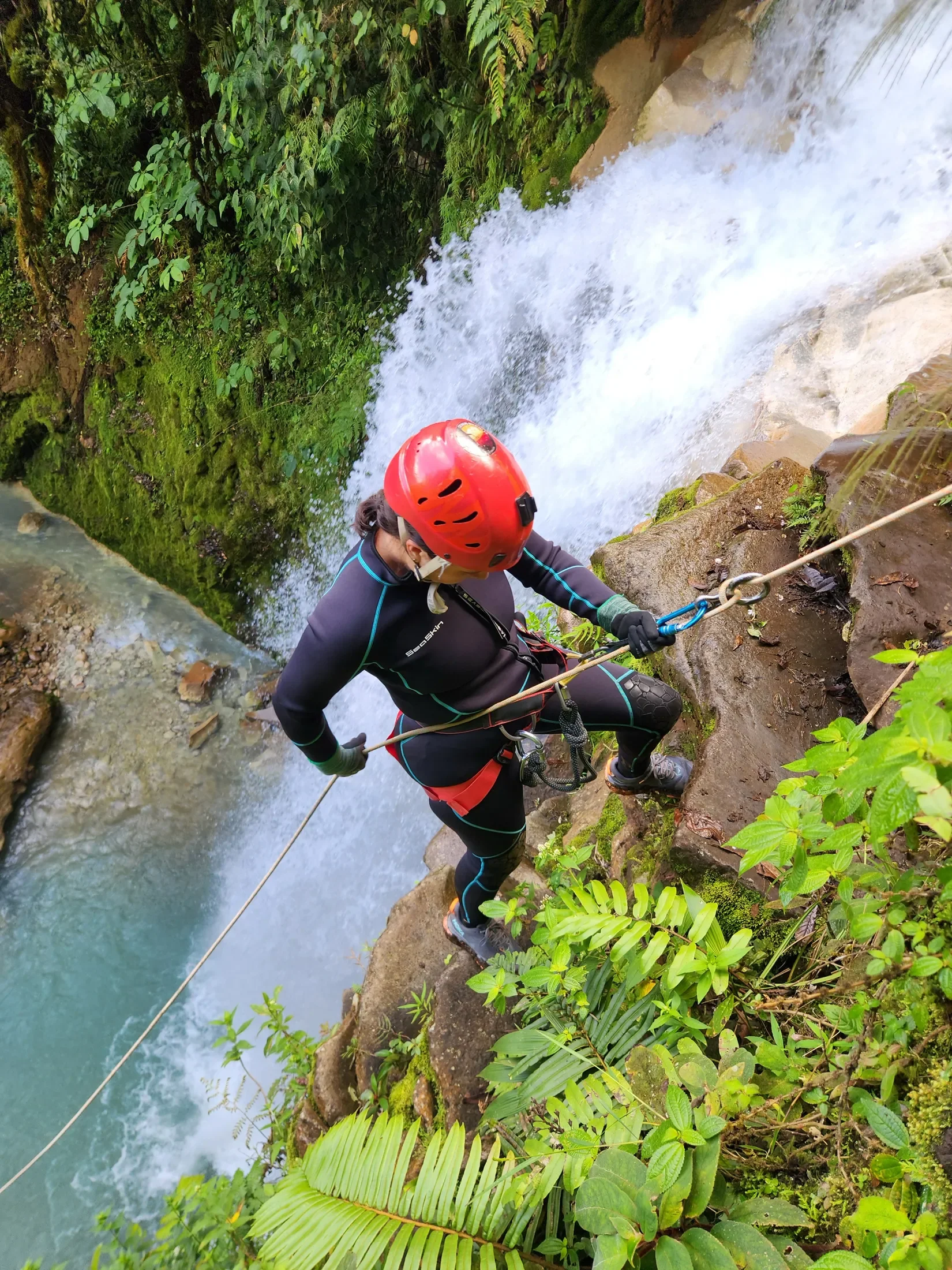 Woman mountain climbing during her Costa Rica Vacation