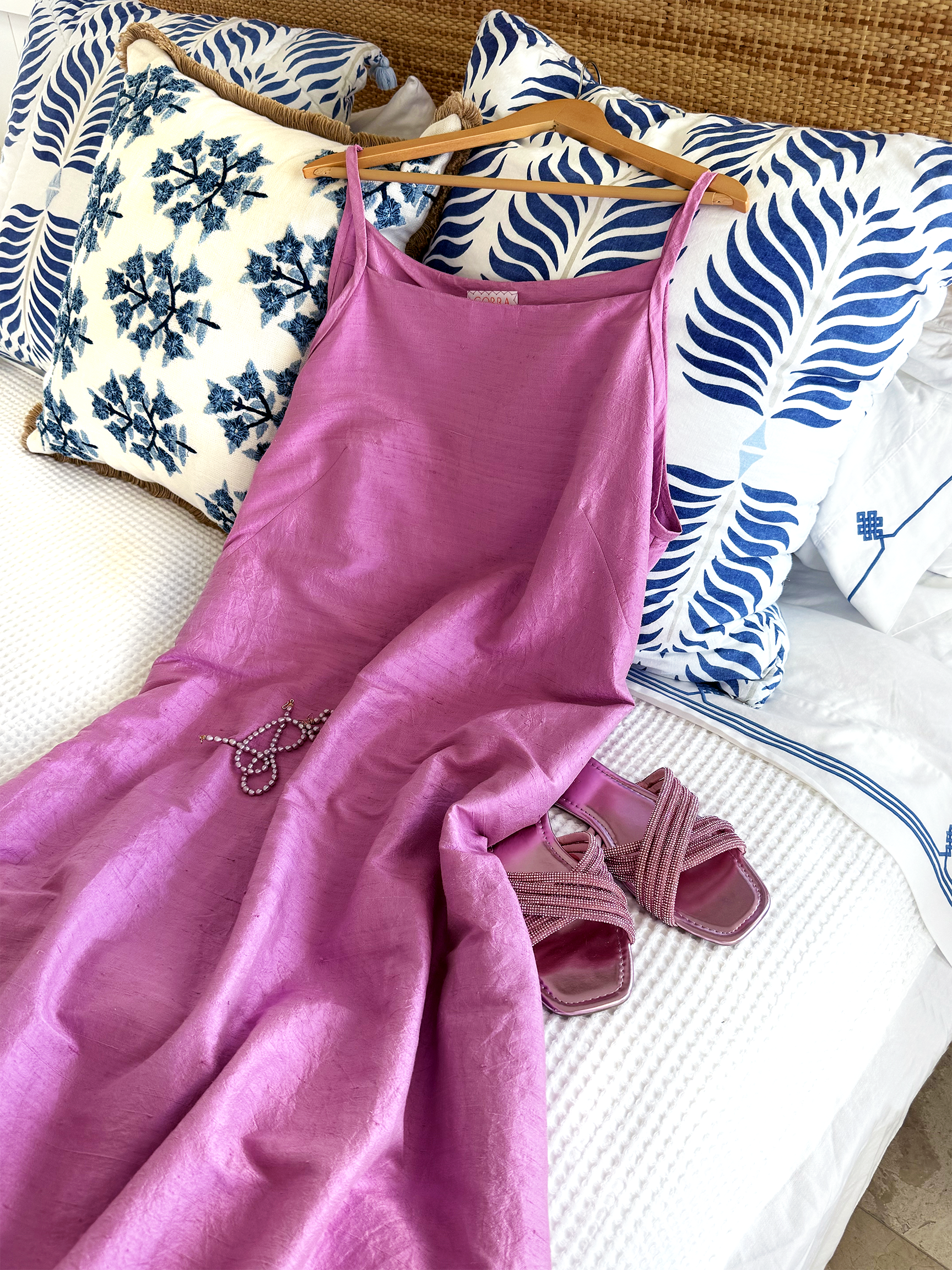 sand so sea raspberry silk dress on bed 1.png