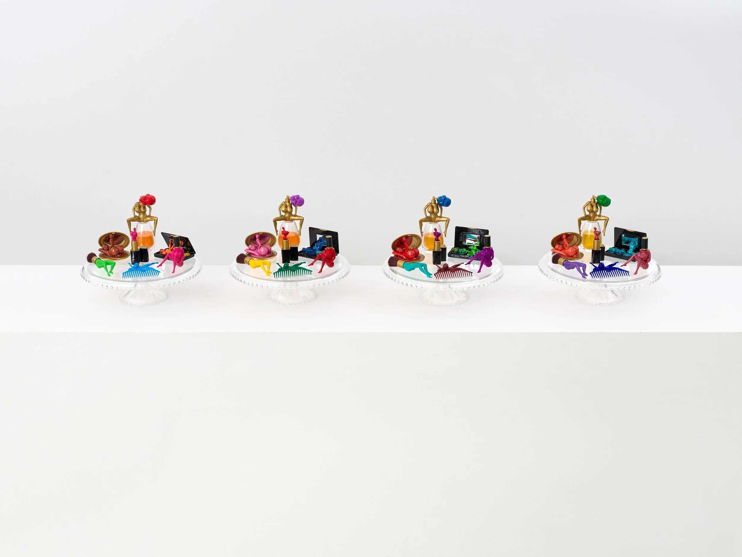 Kauf Dich Schön I, II, III & IV, 2026, Resin, plastic, glass, acrylic, 24k liquid gold finish, 26 x 30 x 30 cm, 10 ¼ × 11 ⅞ × 11 ⅞ in