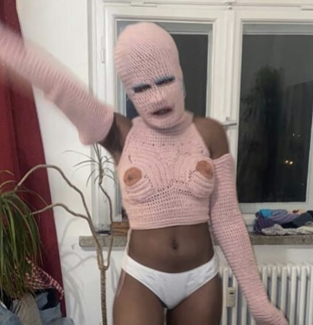 Performance by Kensise Anders in a crochet threads face mask and body suite, dimension variable