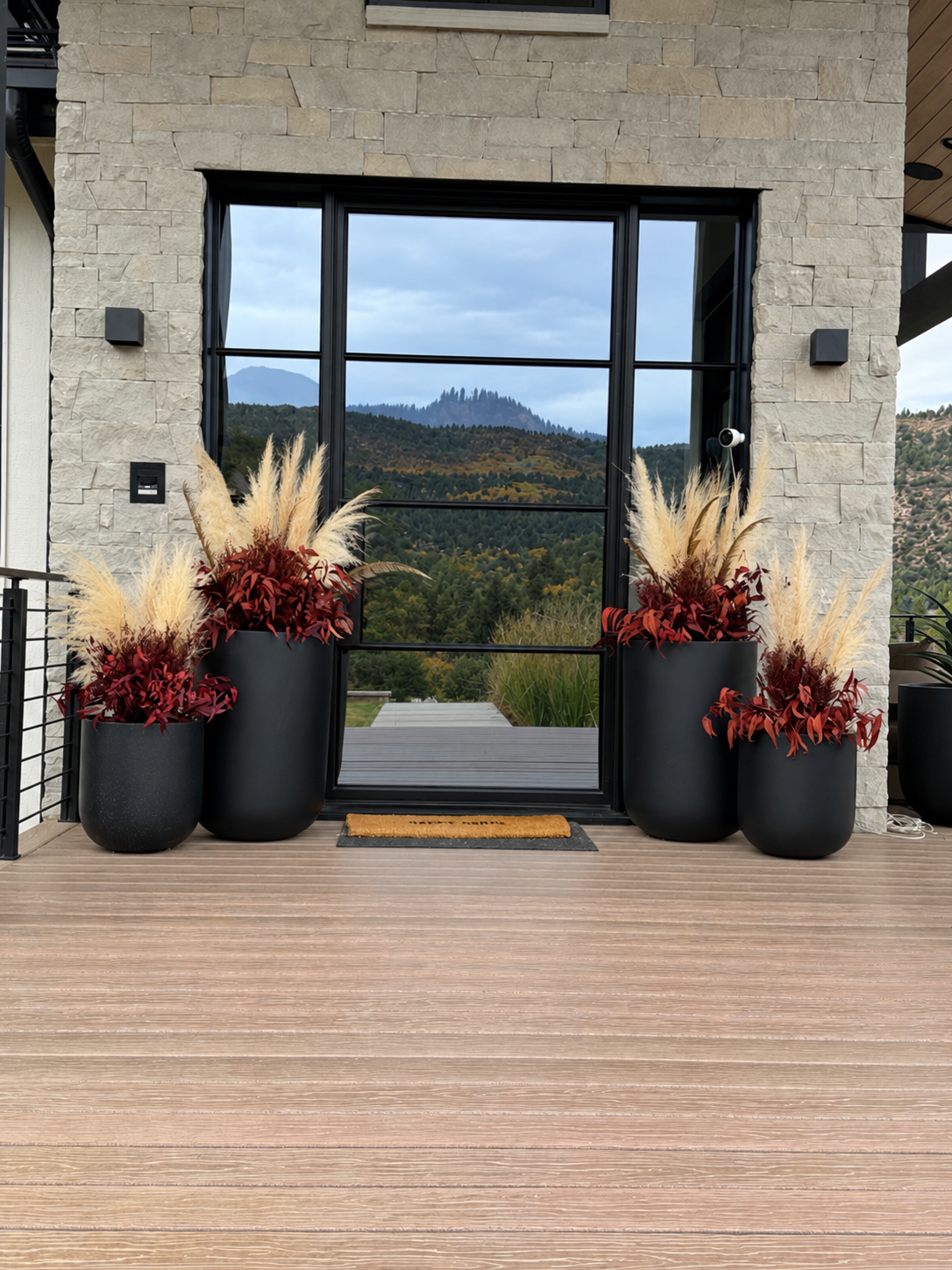 Modern Stone-Clad Entryway with Mountain Reflections.png