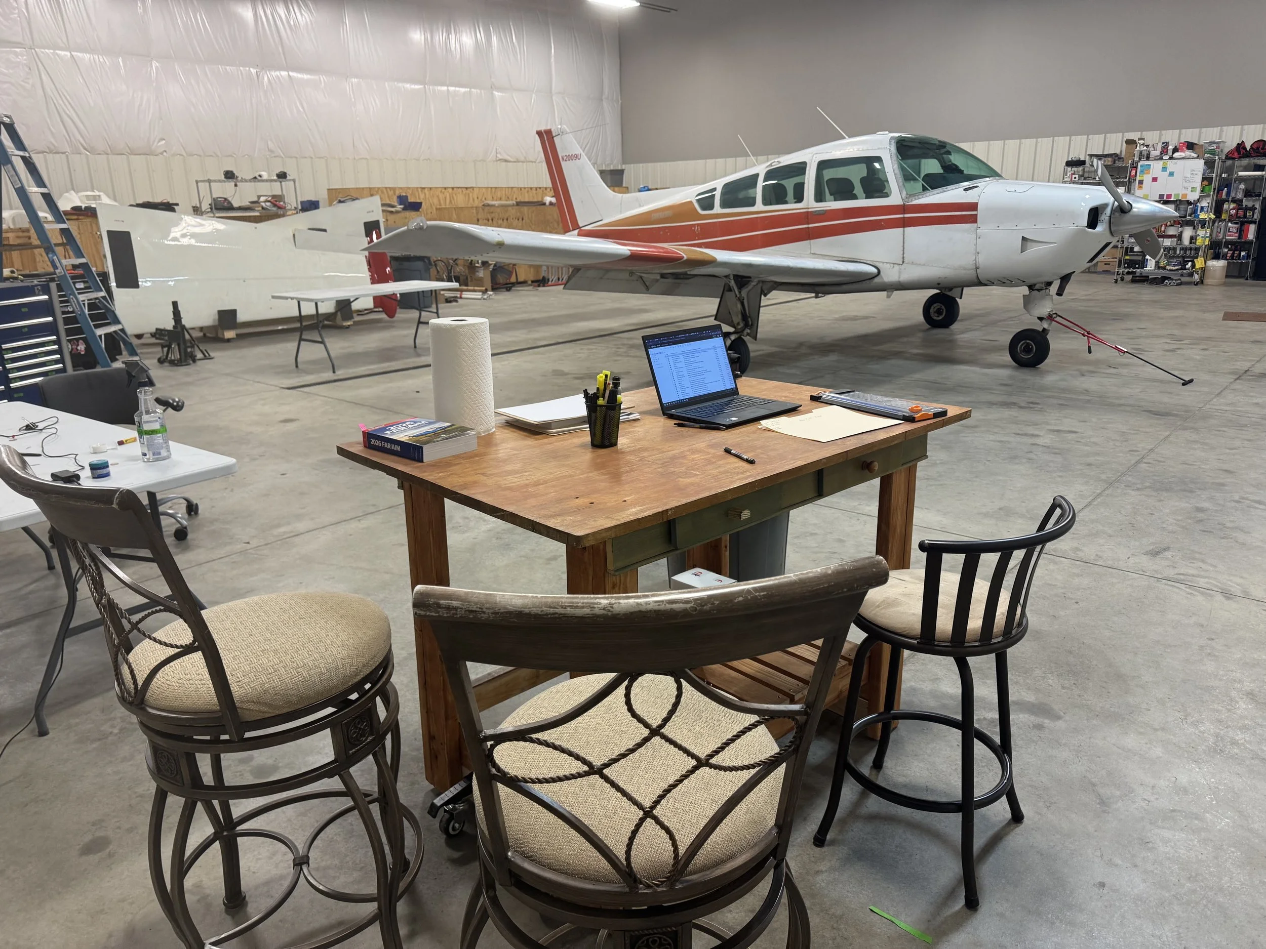 Aviation maintenance hangar and aircraft.