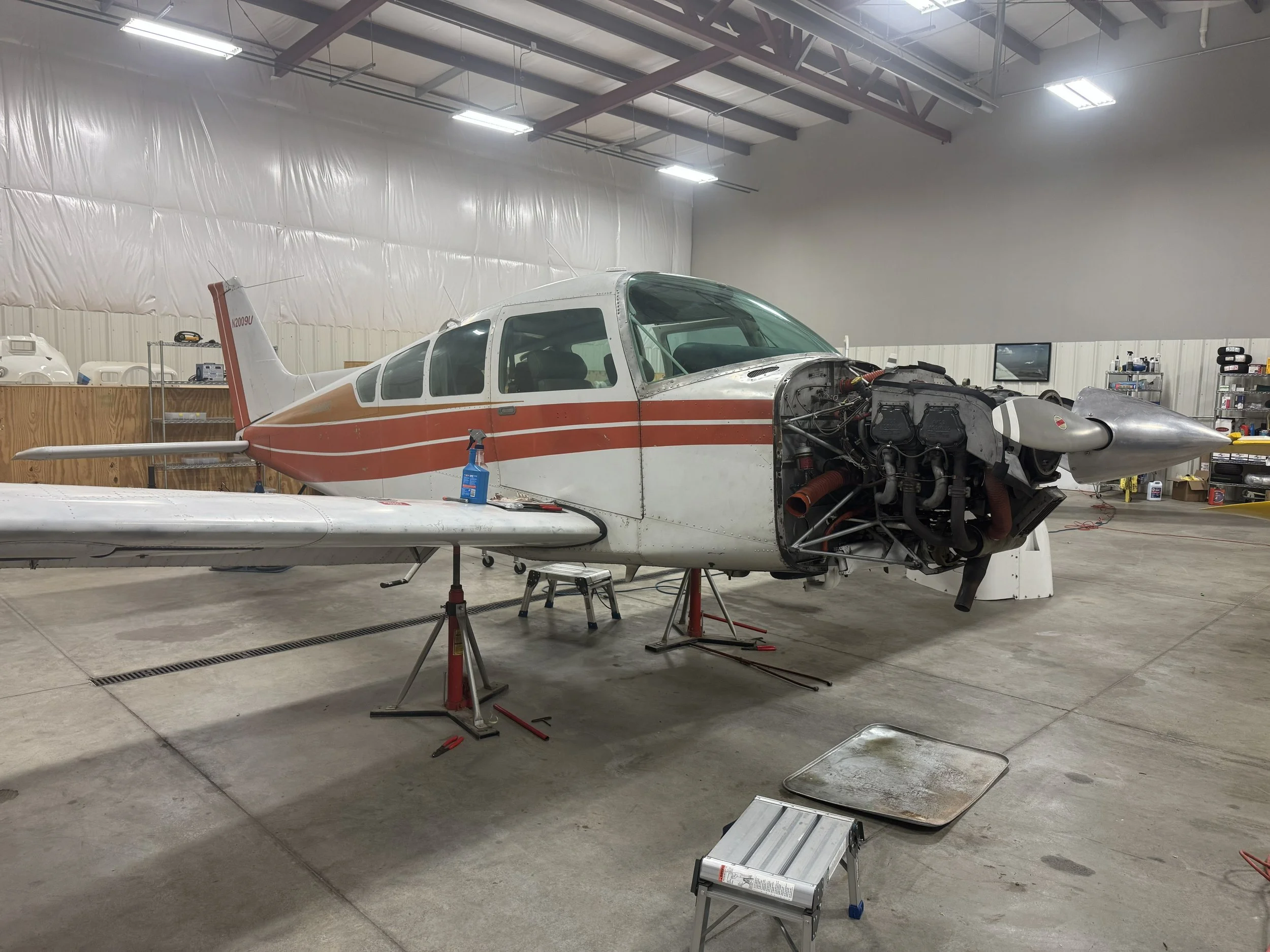 Beechcraft Sierra on jacks for annual inspection.