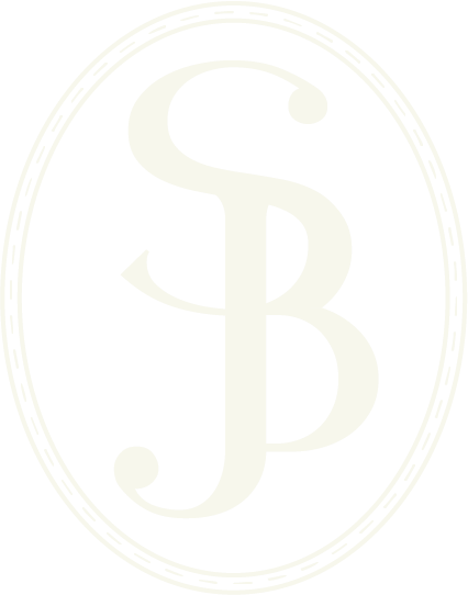 SJB Combined together to create Shannon Jensen-Best LMFT Logo mark in a oval shape in the color Cream