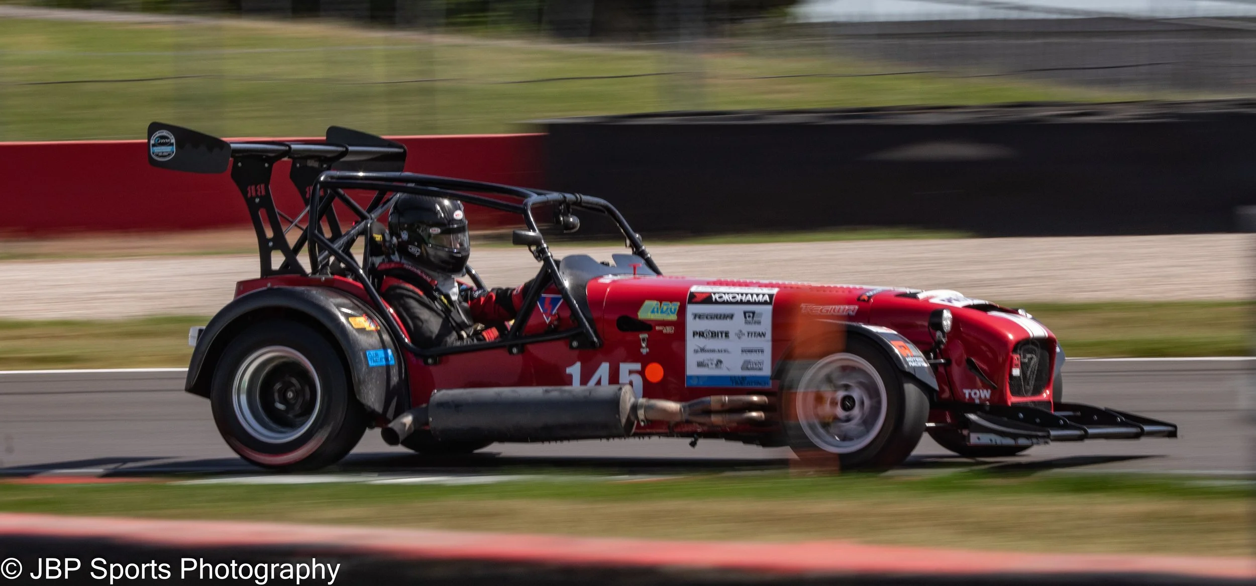 A Time attack modified Caterham 7 Enters Coppice at Donnington Park