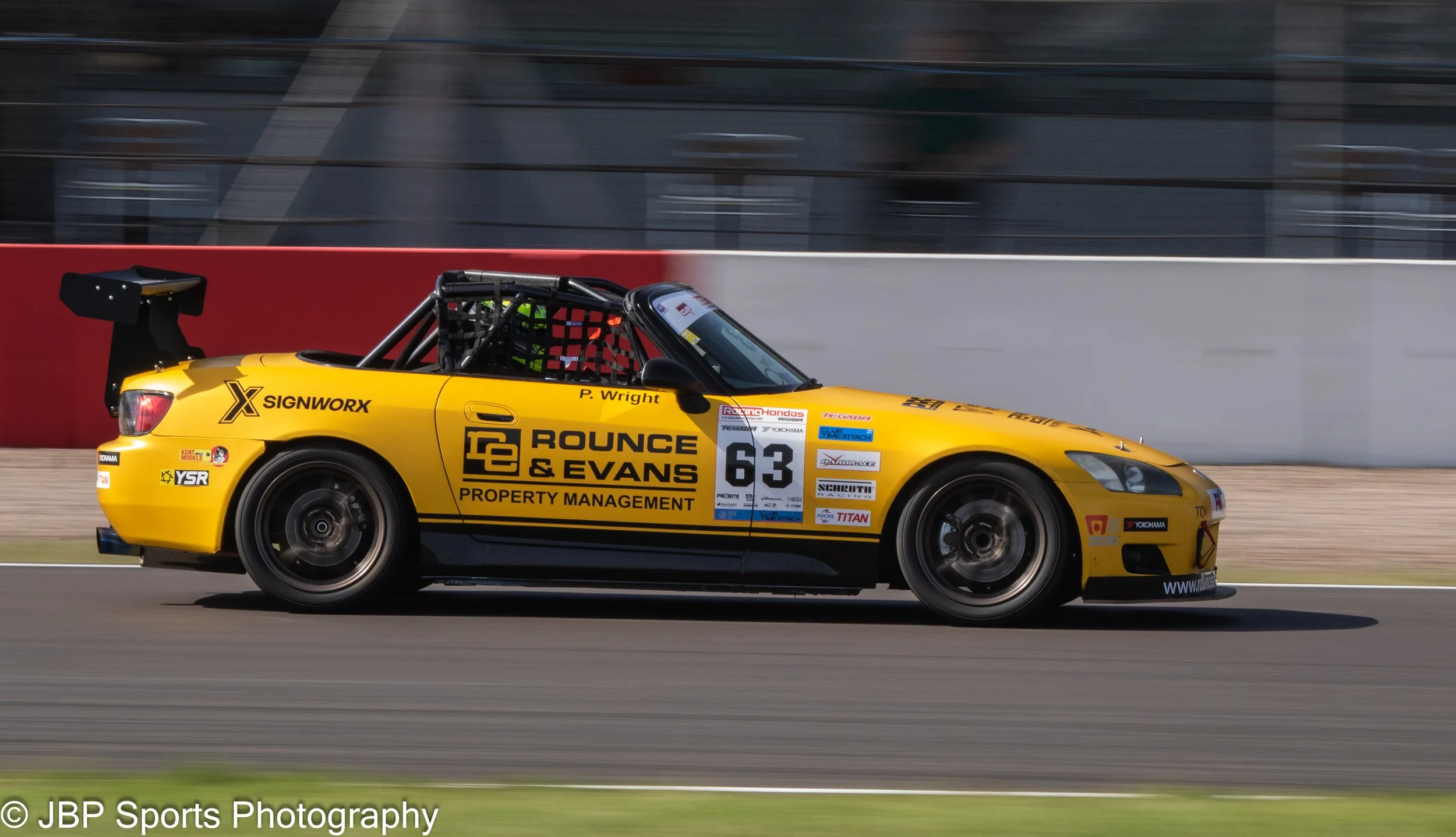 A beautiful Yellow time attack Honda S2000 enters Redgate at Donington Park