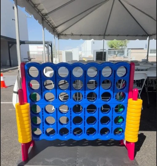 Giant stackable wooden block game rental set up for an outdoor event in Phoenix, Arizona.