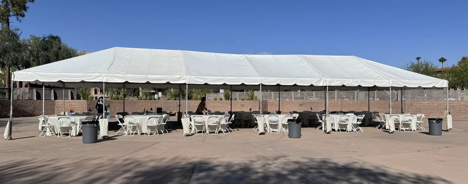 Large white event tent with room for a gathering