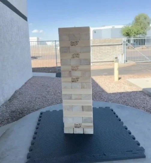Giant stackable wooden block game rental set up for an outdoor event in Phoenix, Arizona.