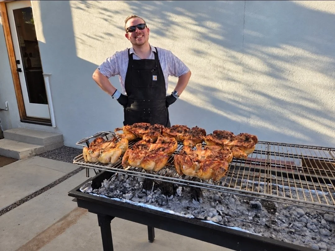 Charcoal grill with chicken cooking on the grill for an outdoor party, barbecue or event in Phoenix, Arizona
