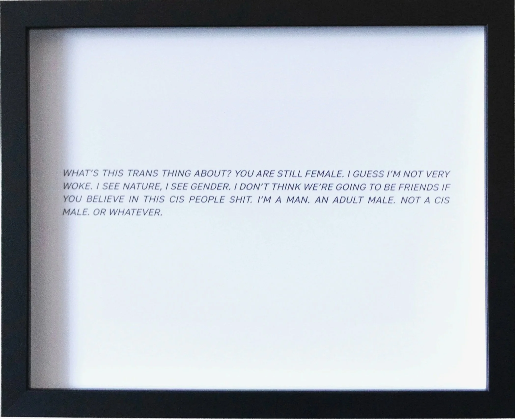 A digital screen displaying a quote about gender and identity in black text on a white background.