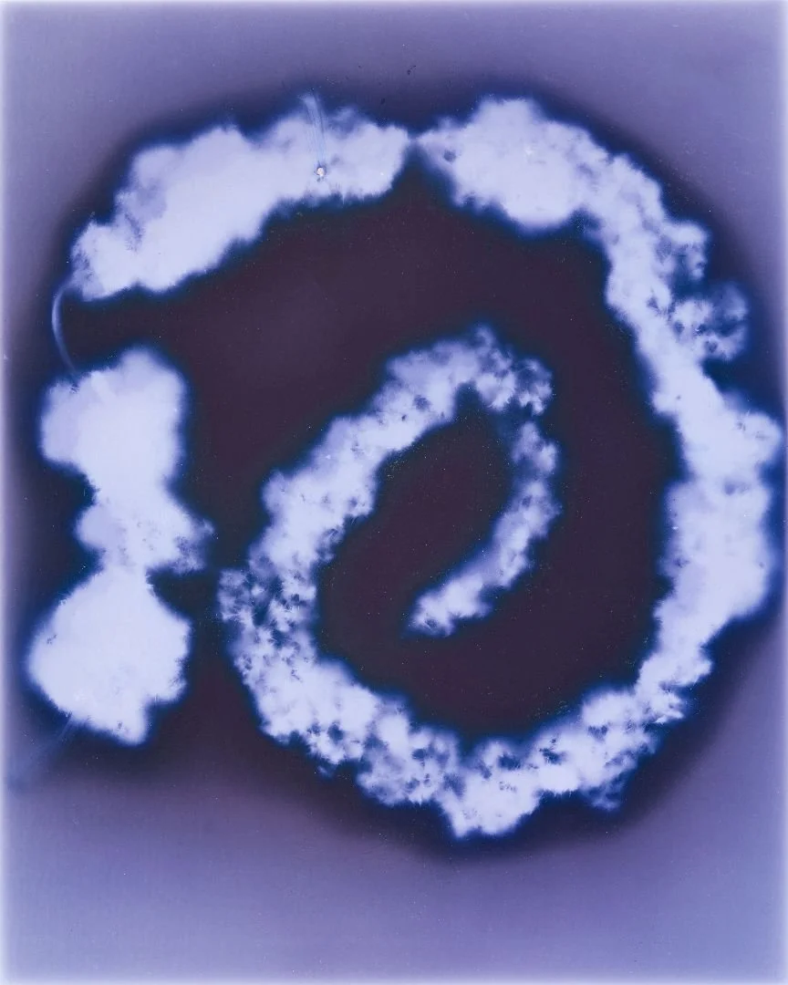 Skywriting of the number 20 surrounded by clouds in the sky.