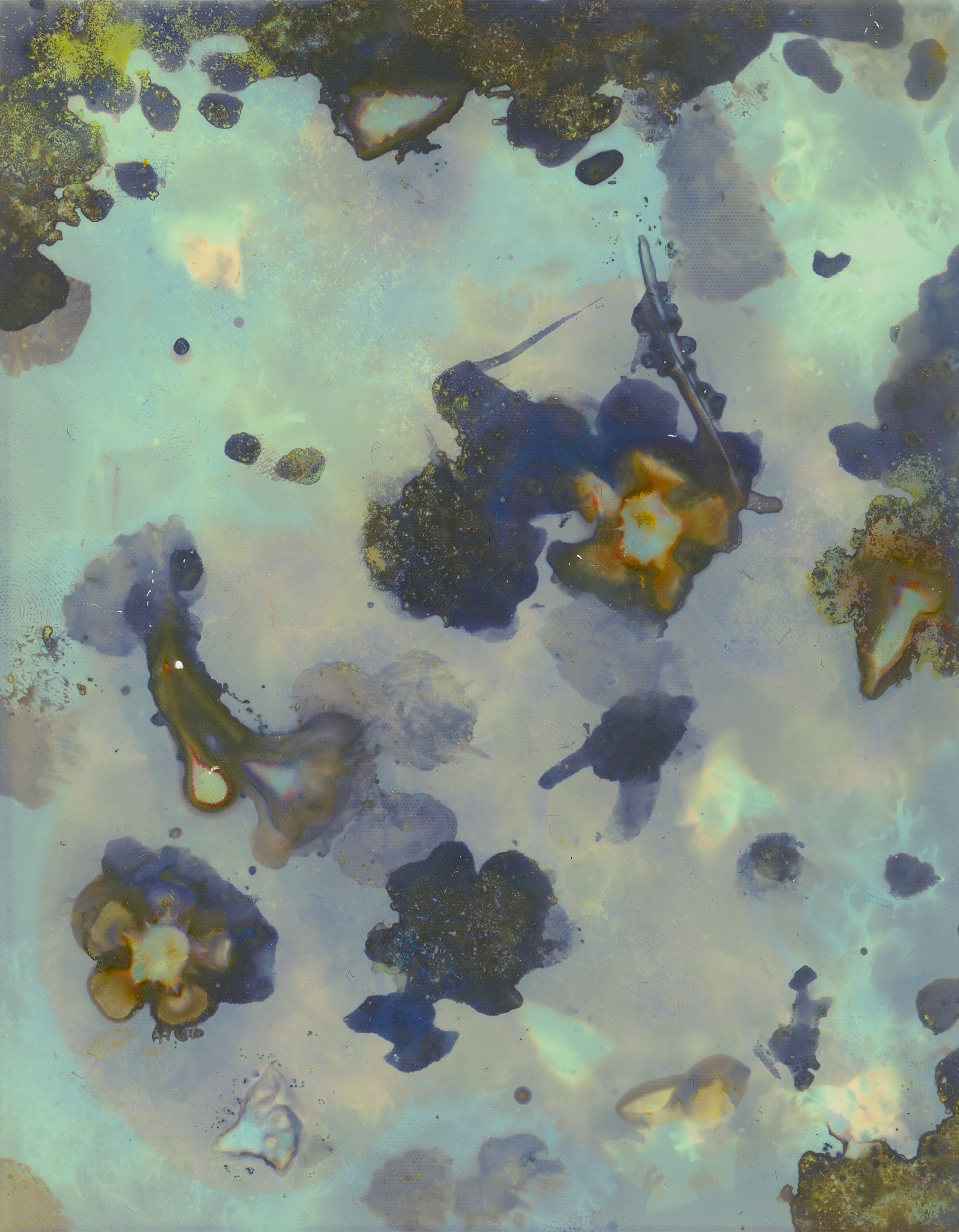Abstract image with various colored patches, irregular shapes, and a mix of blue, green, yellow, and brown hues.