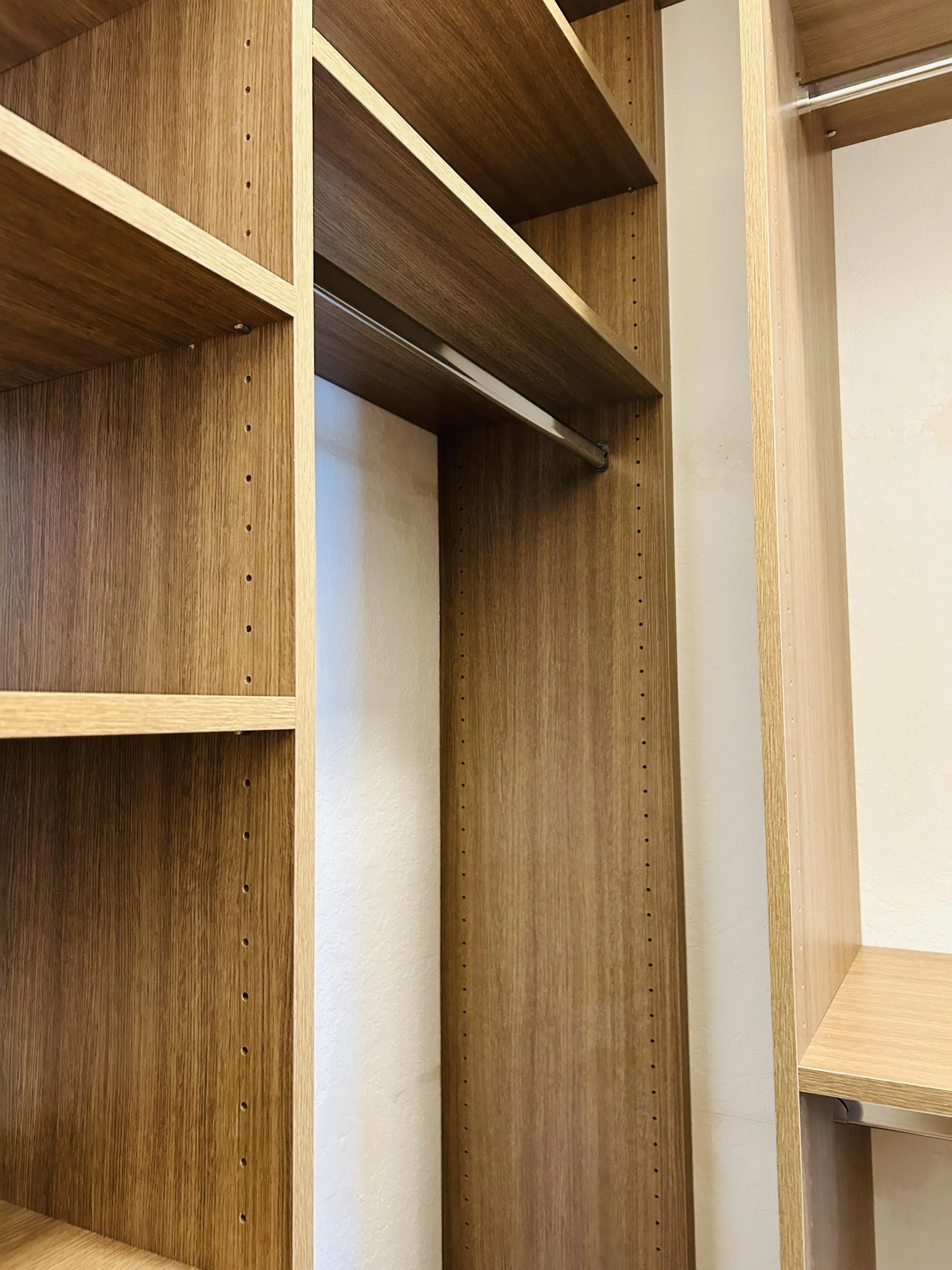 Premium Daytona walk-in closet featuring shoe storage, drawers and adjustable shelving.