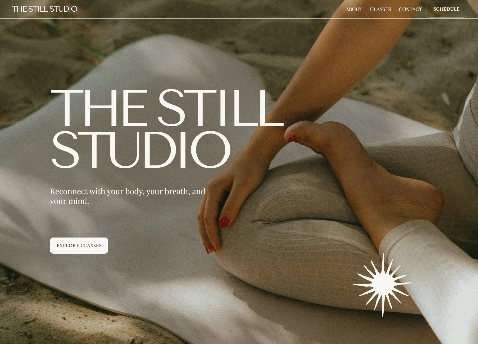 A yoga studio hero section with a close up of a woman sitting in cross-legged yoga and meditation pose on a yoga mat on a beach.