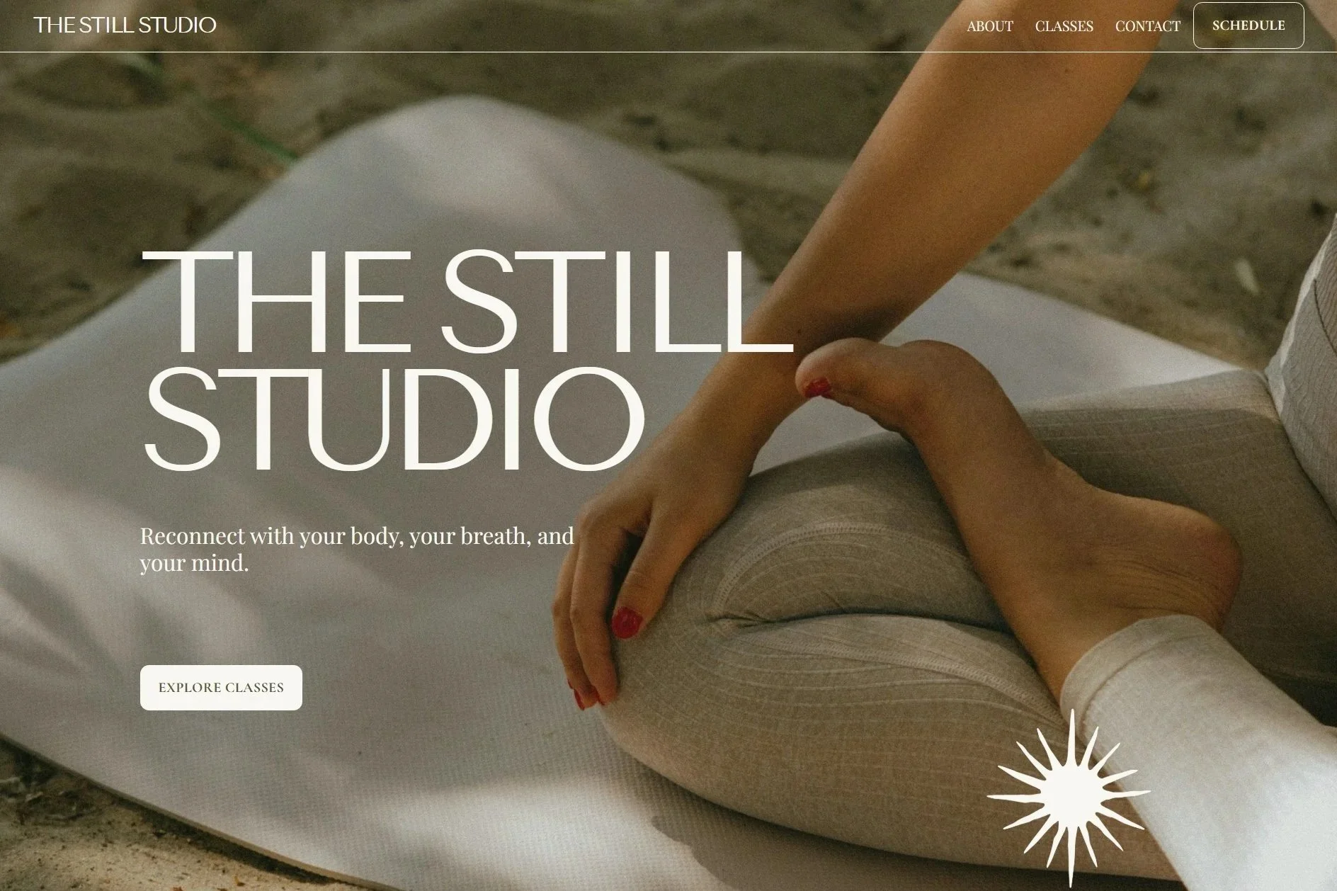 Hero section of a beach yoga studio website called "The Still Studio". The hero image features an earthy photo close up of a women cross legged on a yoga mat.