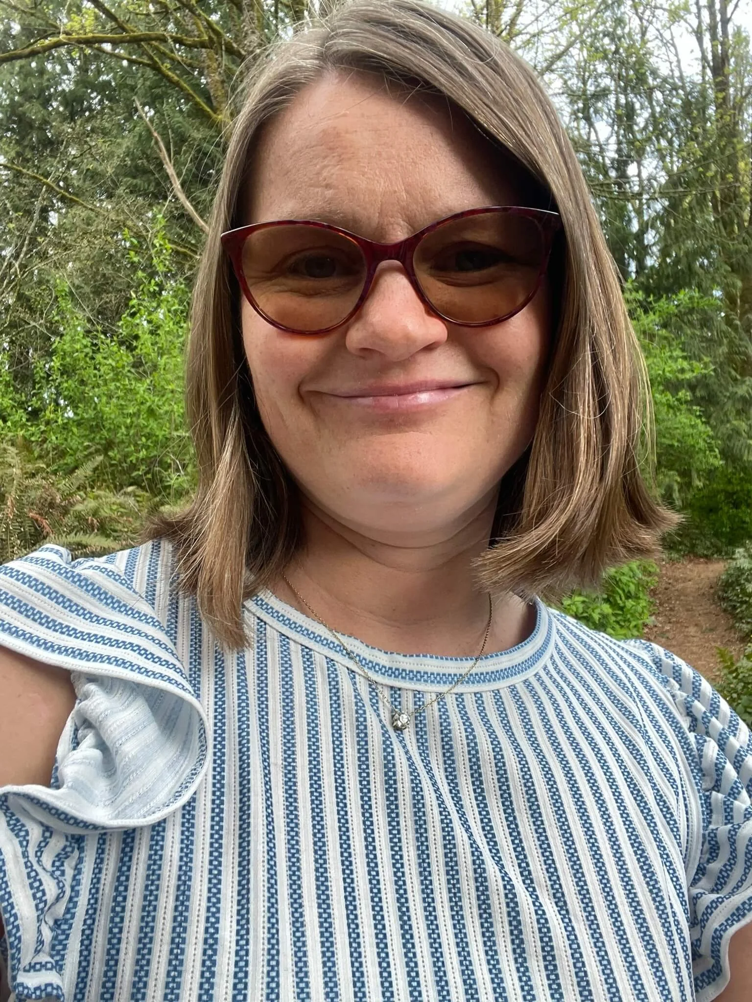 A close-up photo of online Christian trauma therapist Lynn Jones. Are you looking for a therapist who understands your faith and your struggles? Online therapy for women in Mill Creek, WA, can help you feel seen, heard, and understood.