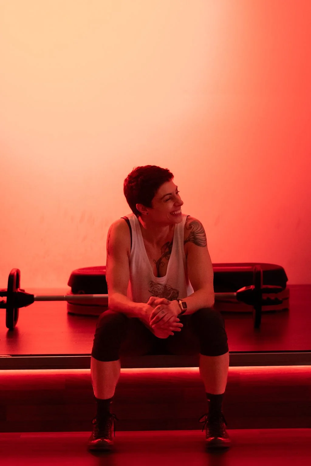 Personal Trainer Marie sitting on stage