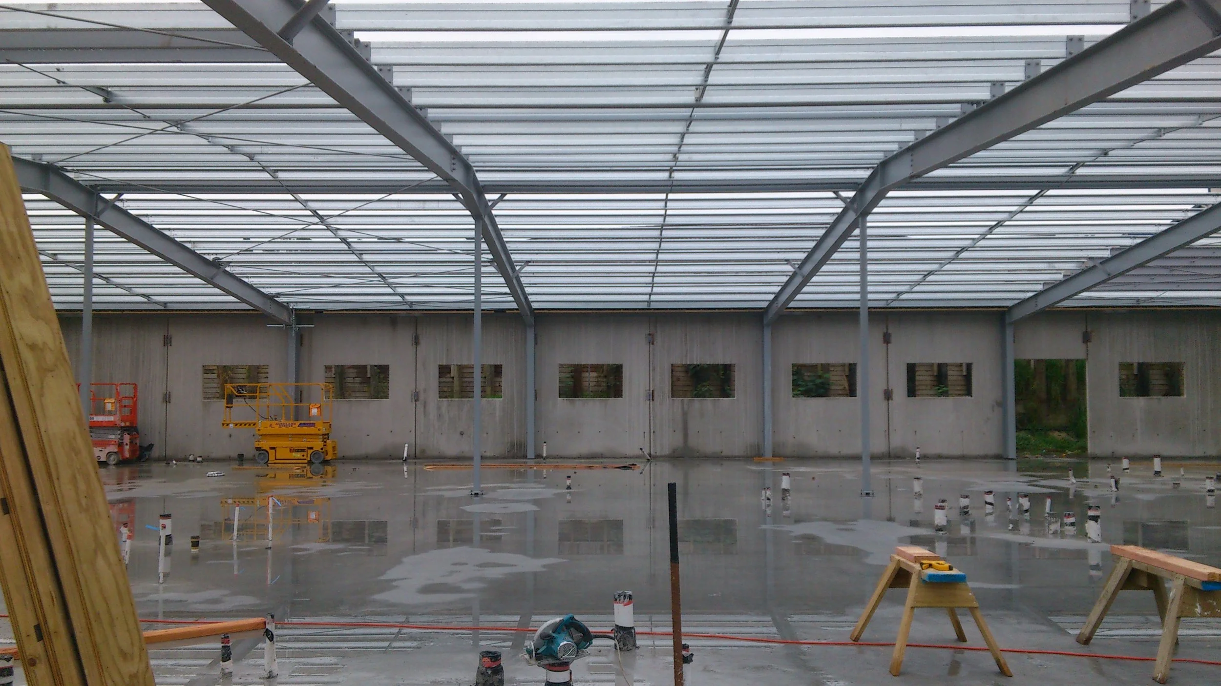 Contemporary commercial property during construction showcasing integrated retail spaces and professional office floors designed by K&K Structures Limited.