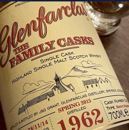 Close-up of a Glenfarclas single cask Highland single malt Scotch whisky bottle label showing distillery details and 1962 age statement.