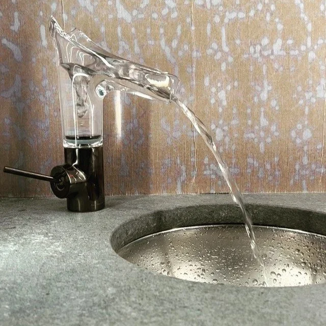A bespoke crystal faucet used to create a 
holistic design for a wet bar in a 2024 remodel