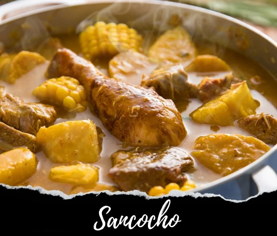 A pot of Sancocho, a traditional stew with meat, corn on the cob, potatoes, and vegetables in a light broth.