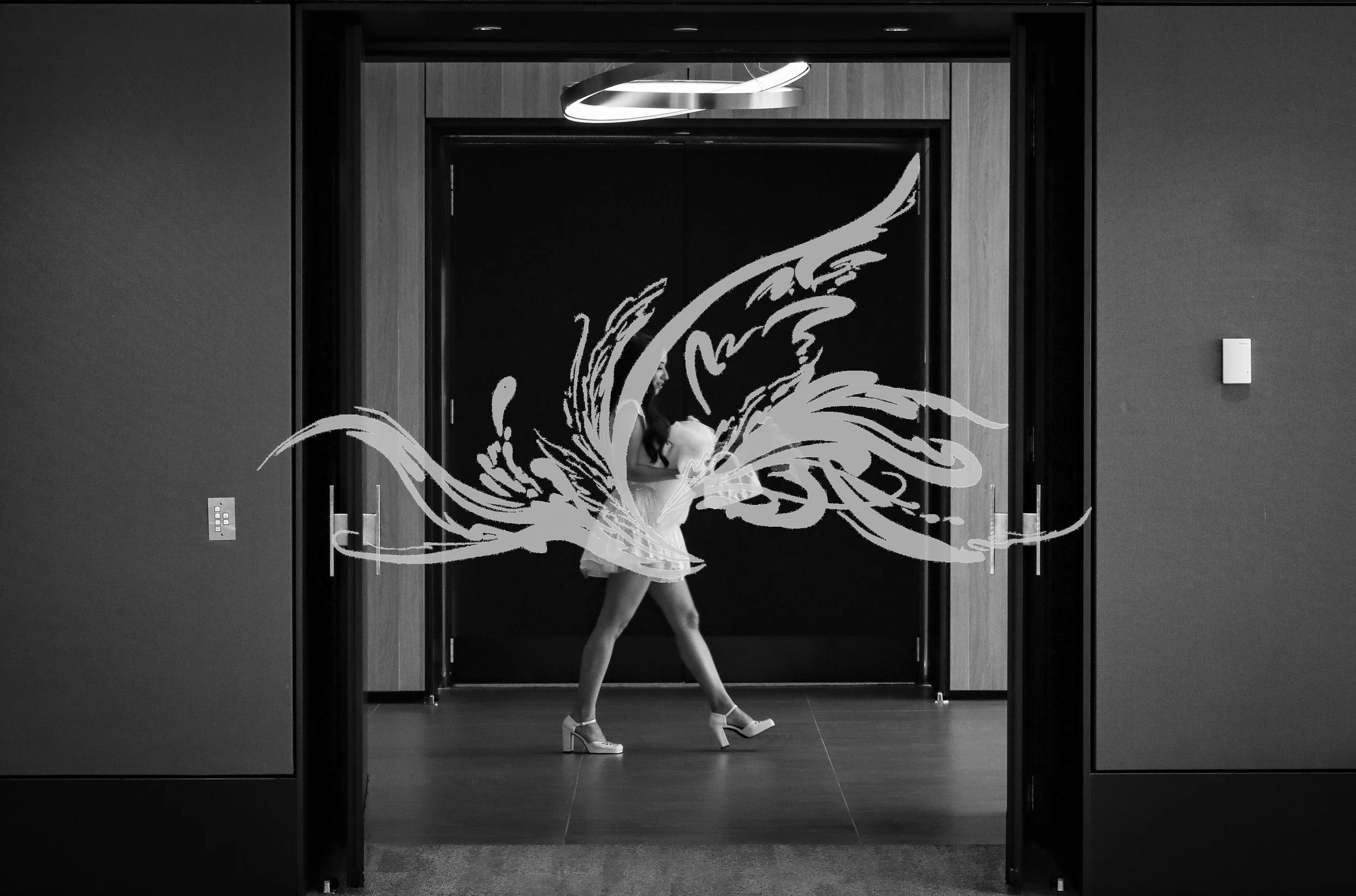 A woman in a dress and high heels dancing in an elevator with a floral and abstract design.