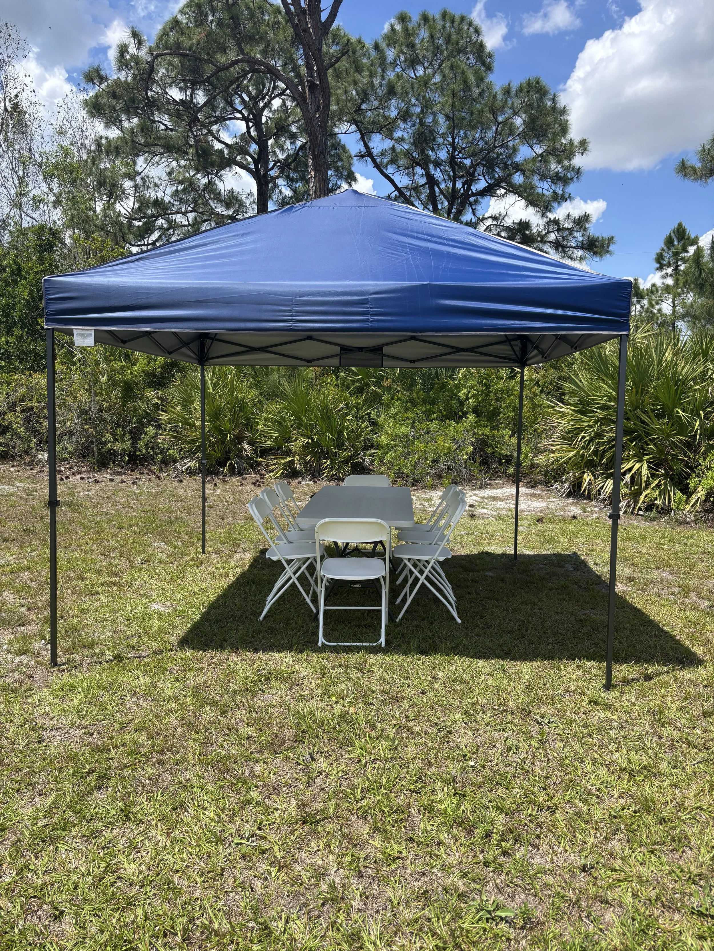 10x10 pop-up canopy tent rental with folding chair and table — 100 sq ft of shade, pickup or delivery, Saltwater Event Co. Treasure Coast FL