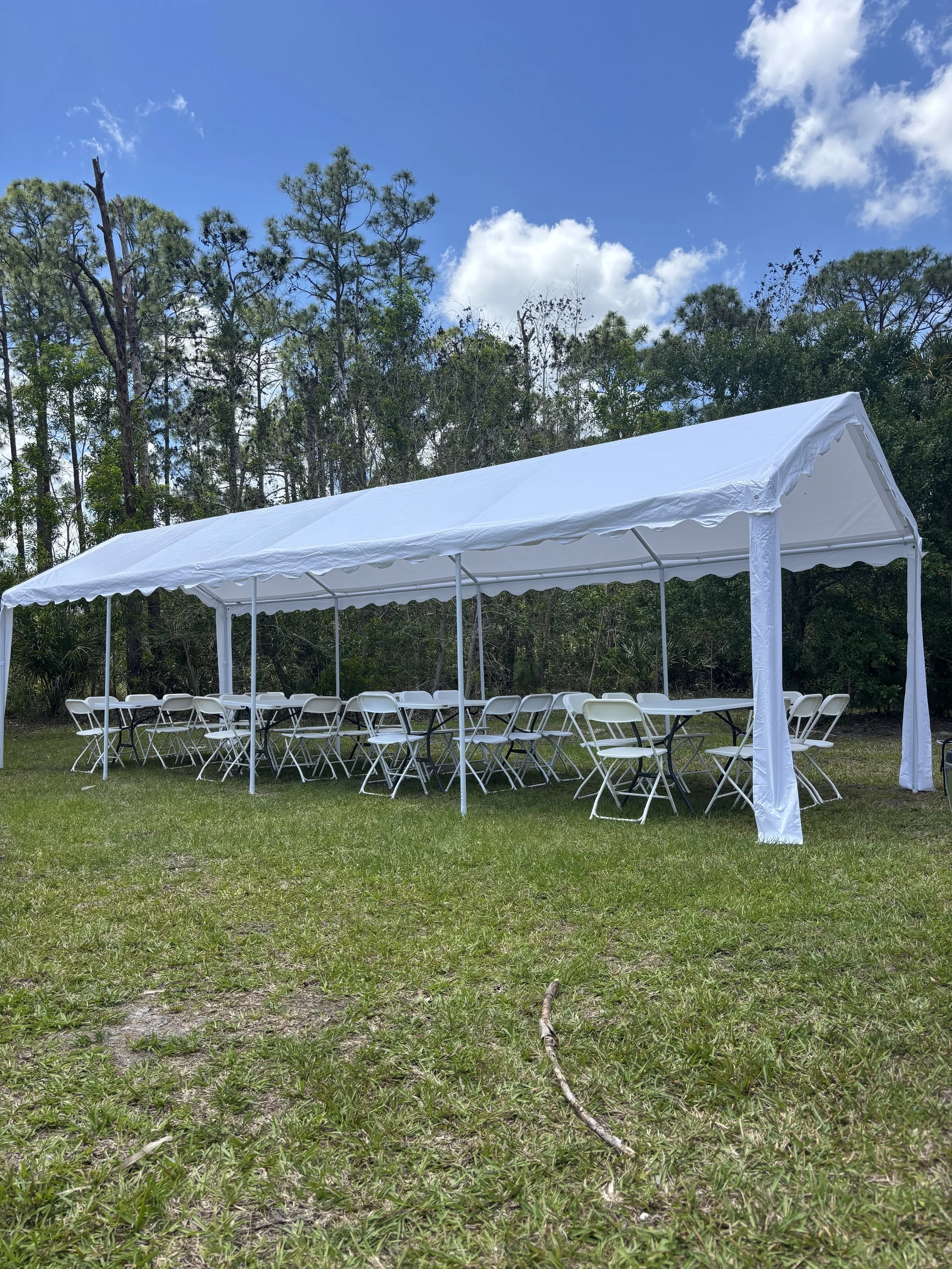 10x30 white frame tent rental with tables and chairs — seats up to 32 guests, setup included, sidewalls available, Saltwater Event Co. Indian River County FL