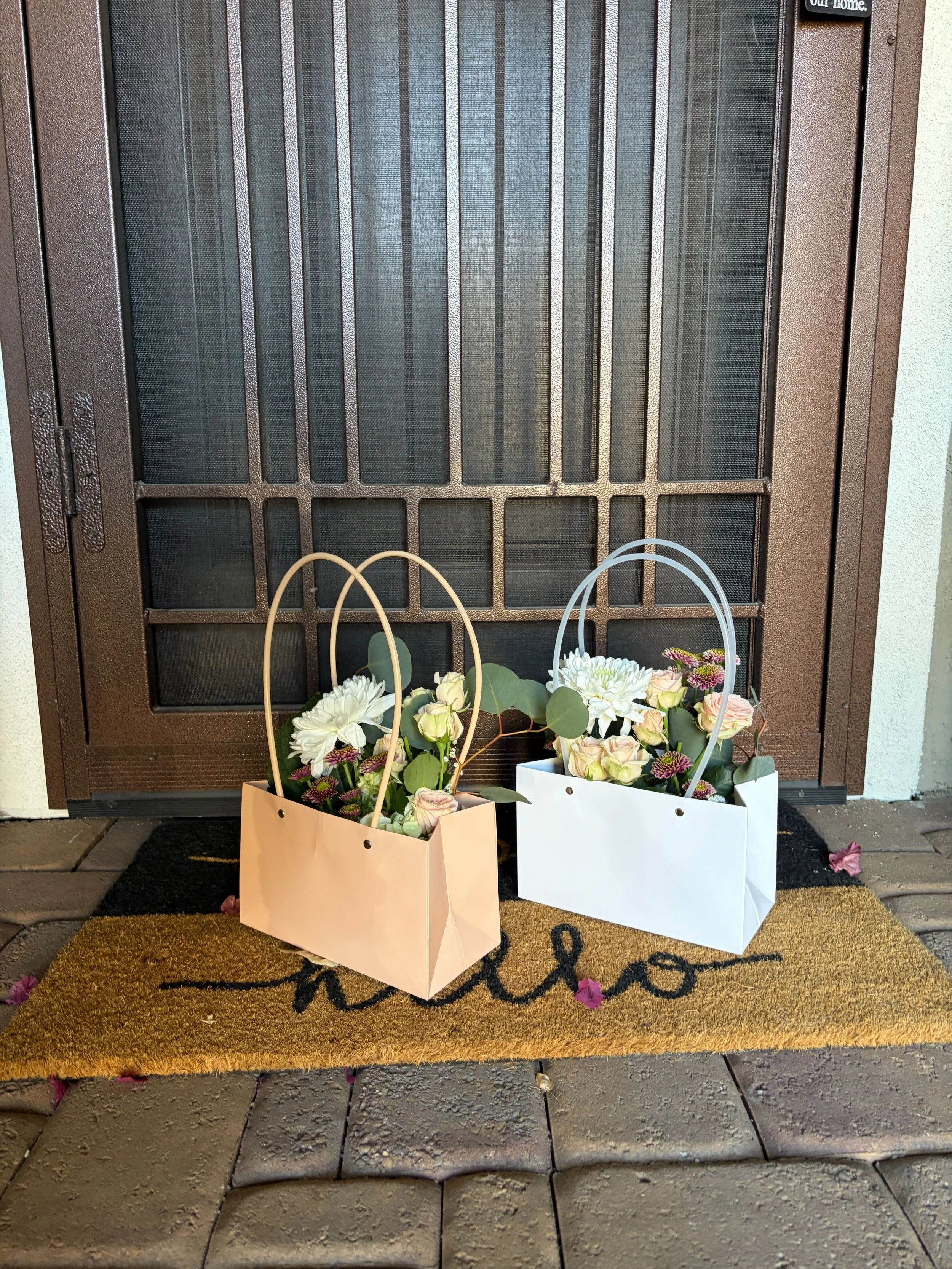 Two flower purses filled with fresh blooms delivered to a neighbor's doorstep!