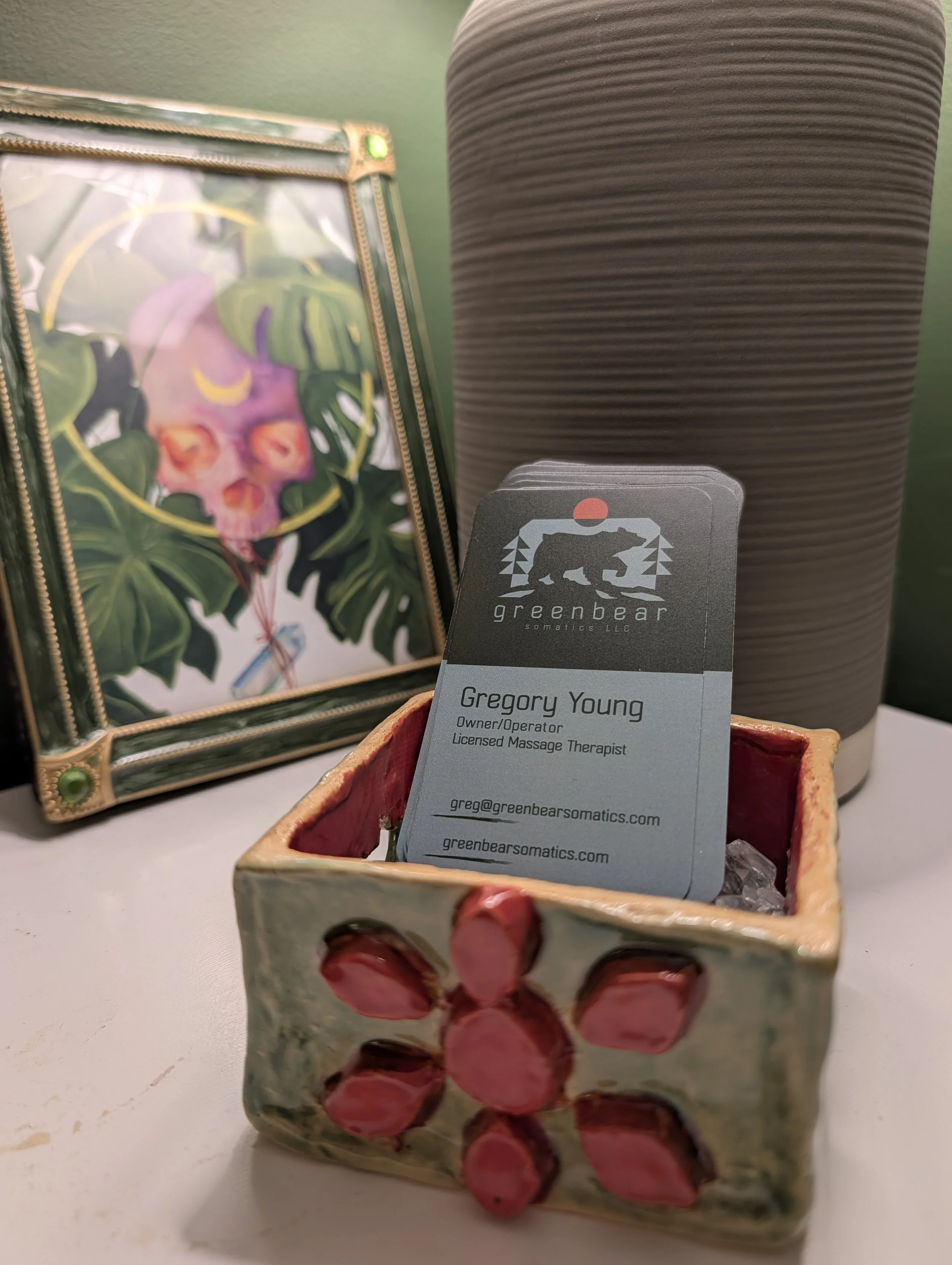 small table decorations showing the business card for Greg