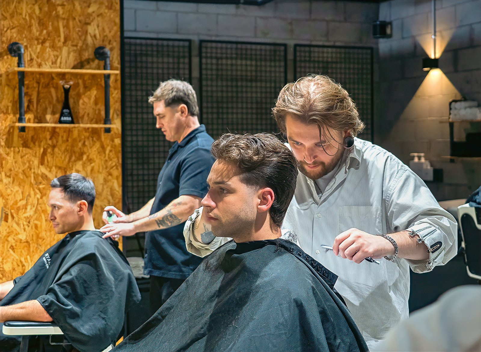 Men getting a faded barber haircut in The Valley