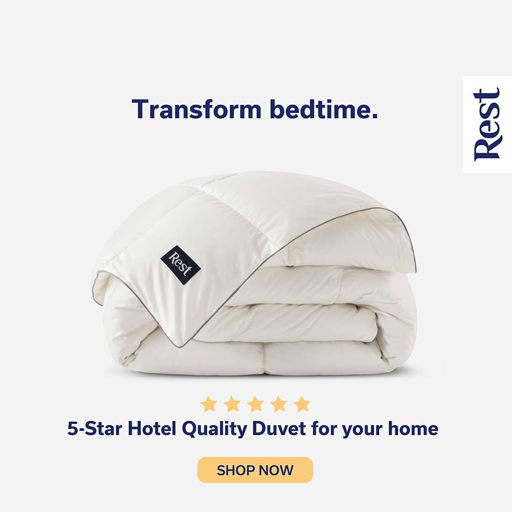 A folded white duvet with a black label reading 'Rest' and text saying 'Transform bedtime' and '5-Star Hotel Quality Duvet for your home' with a 'Shop Now' button.